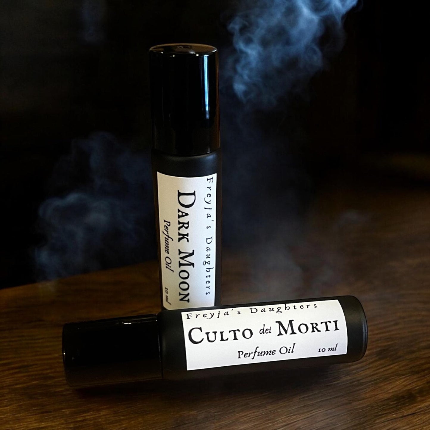 a roll of perfume sitting on top of a wooden table