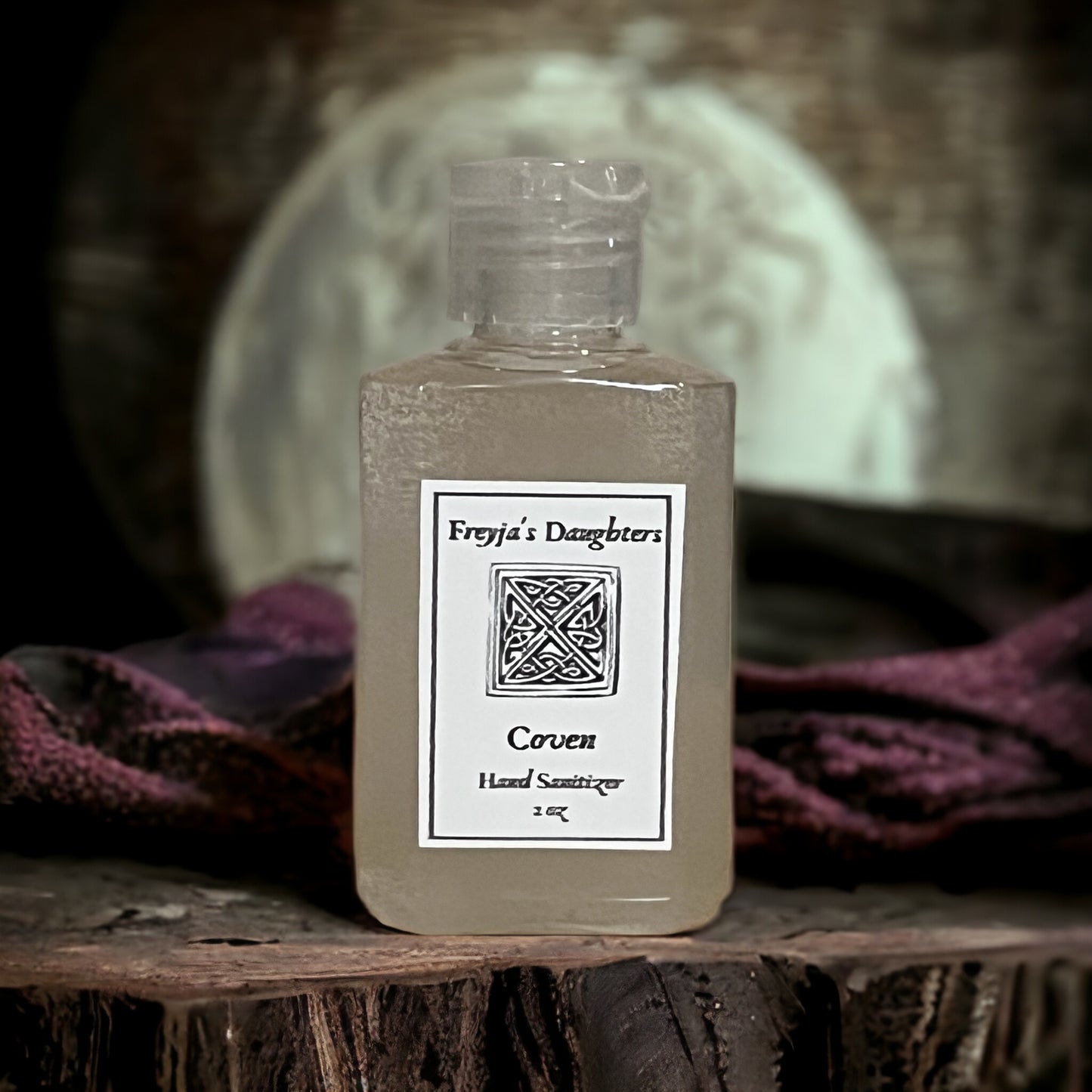 a bottle of liquid sitting on top of a wooden table