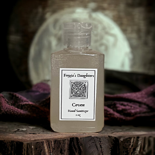 a bottle of liquid sitting on top of a wooden table