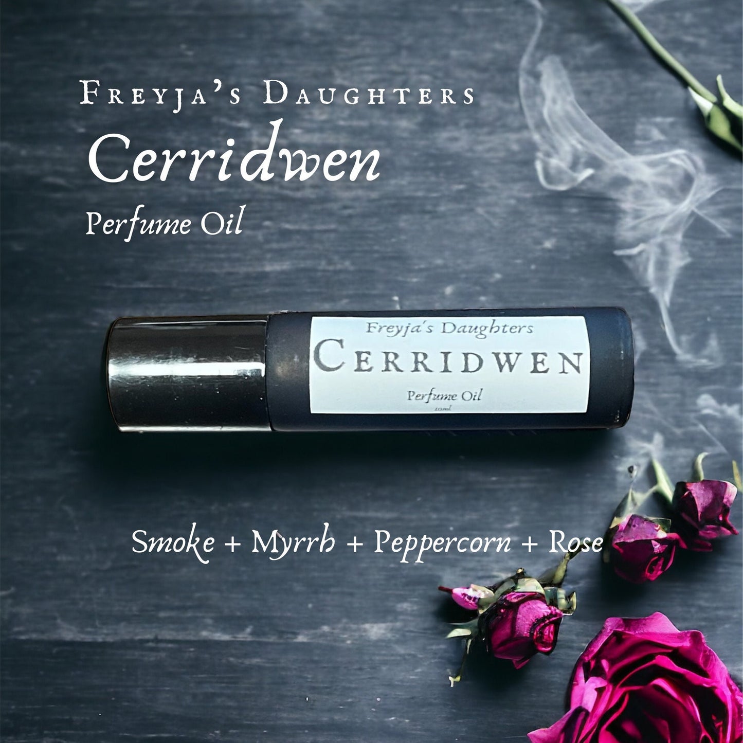 a bottle of ceriddwen perfume next to a pink rose