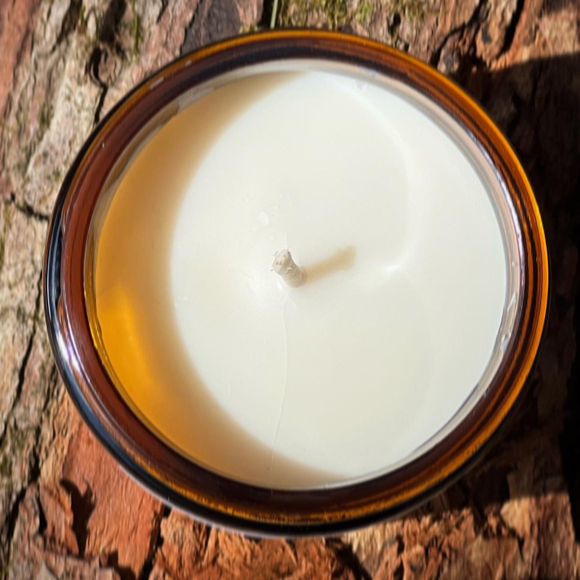 a candle sitting on top of a wooden table