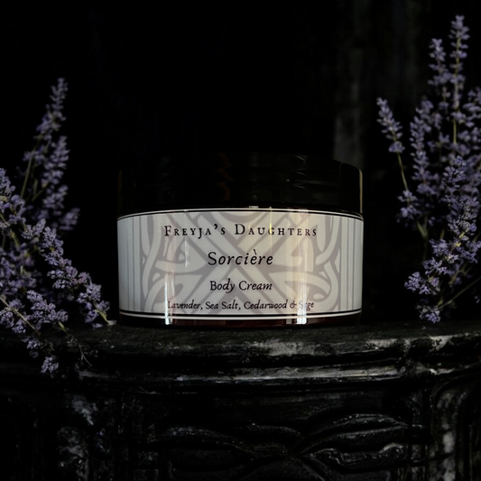 a jar of body cream sitting on top of a table