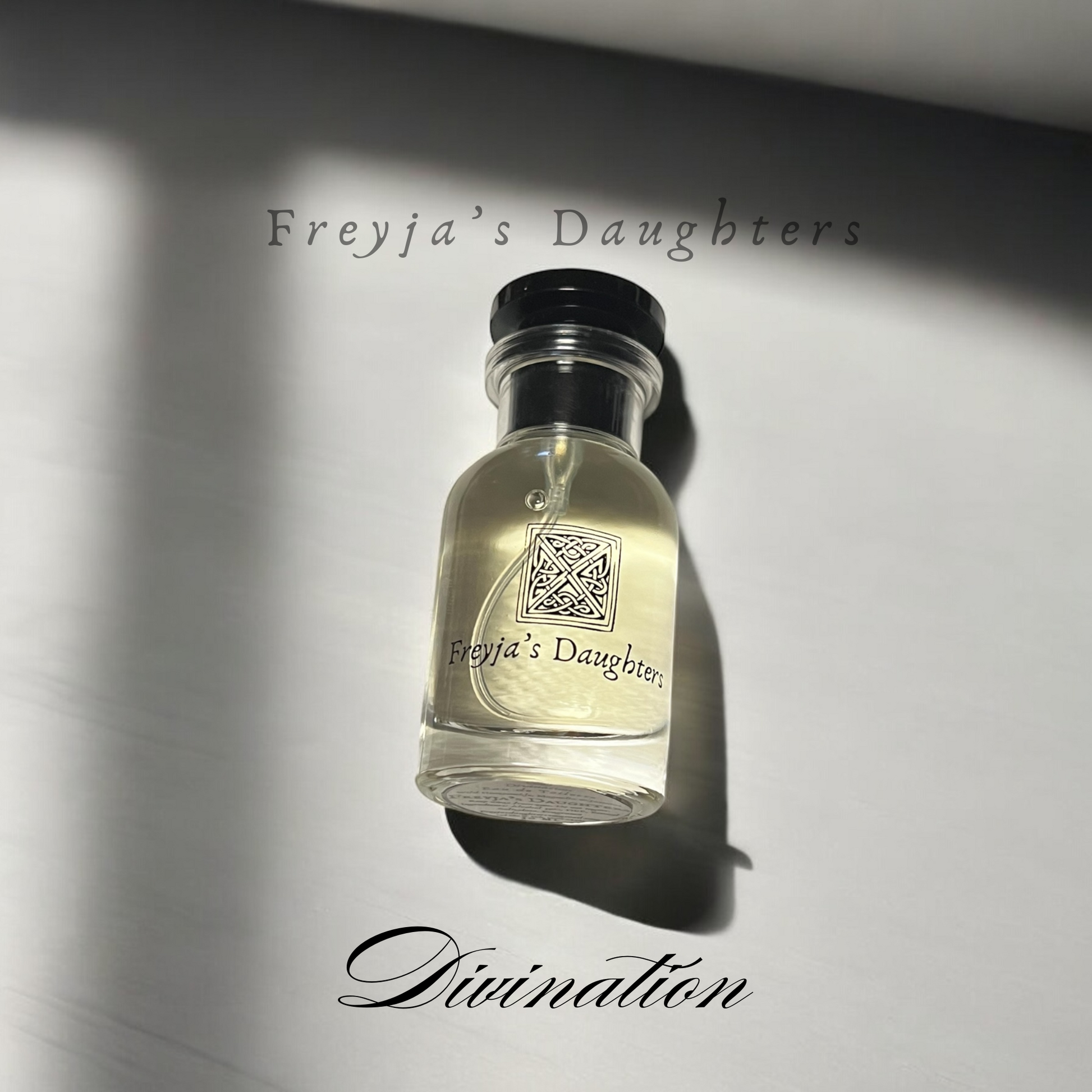 a bottle of perfume sitting on top of a table