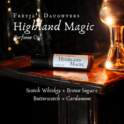 a bottle of perfume oil sitting on top of a wooden table