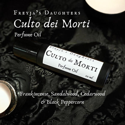 a close up of a bottle of perfume on a table